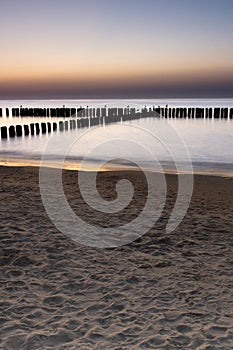 breakwaters during sunset on the Baltic. Long exposure.