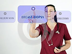 BREAST BIOPSY phrase on the screen. Nurse use cell technologies at office