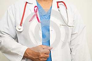 Breast cancer, Asian doctor woman with pink ribbon, symbol of World Breast Cancer Day