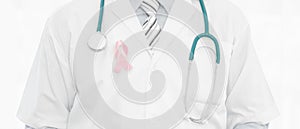 Breast cancer awareness campaign background of doctor in lab coat with stethoscope having breast cancer awareness symbol of pink