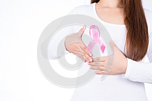 Breast cancer awareness ribbon on woman chest and doing self exam isolated over white background. Medical, healthcare for