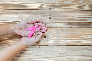 Breast Cancer Awareness, Woman hand holding Pink Ribbon