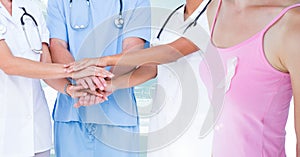 Breast cancer doctor and woman with pink awareness ribbon