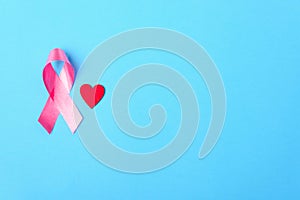 Breast cancer month concept, flat lay top view, pink ribbon and red Heart