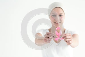 Breast cancer survivor holding ribbon