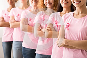 Breast Cancer Survivors Standing In Line On White Background, Cropped photo