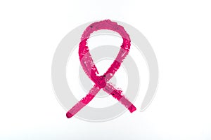 Breast cancer symbol drawn with squirrel lipstick. A pink ribbon as a symbol of women living with a breast tumor