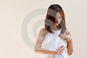 Breast Cancer woman examines her breast