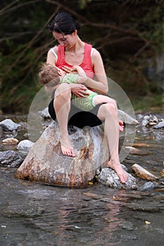 Breast feeding in river