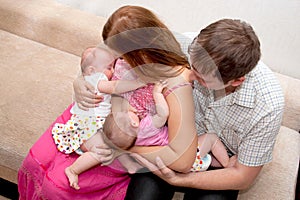 Breast-feeding twin babies at home