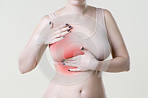 Breast test, woman examining her breasts for cancer, heart attack, pain in human body