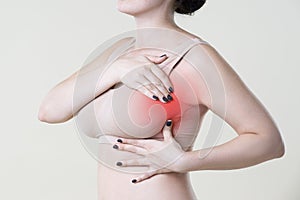 Breast test, woman examining her breasts for cancer, heart attack, pain in human body