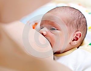 Breastfeeding newborn baby boy