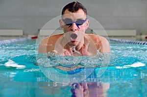 Breaststroke in indoor pool