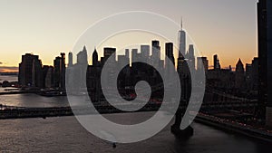 Breath taking romantic shot of downtown skyline at dusk. Silhouettes of modern skyscrapers against colourful sunset sky