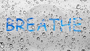 Breathe freedom free abstract background water droplets window glass raining rain dew writing word language sign sky clouds