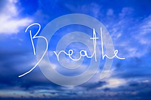 Breathe Handwritten logo in the sky photo