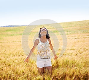 Breathing, freedom or happy woman in a field in the countryside in spring to relax on break. Smile, wellness or female