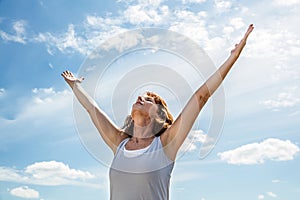 Breathing outside for zen yoga woman raising her arms photo