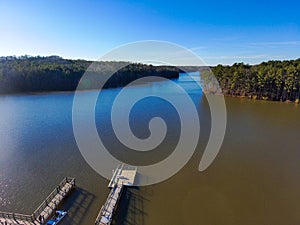 A breathtaking aerial shot of the still blue waters of Lake McIntosh at sunset