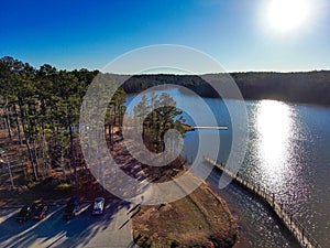 A breathtaking aerial shot of the still blue waters of Lake McIntosh at sunset