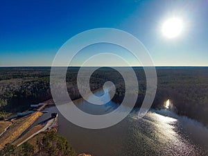 A breathtaking aerial shot of the still blue waters of Lake McIntosh at sunset