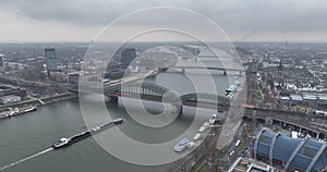 A breathtaking aerial video of Cologne's famous bridge and bustling city center showcasing its stunning skyline