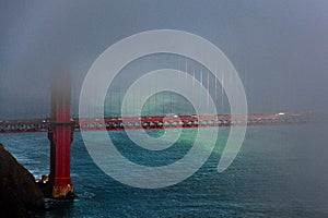 Breathtaking aerial view of dark clouds covering the Golden Gate Bridge in San Francisco, California