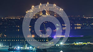 A breathtaking aerial view of the Palm Jumeirah at night from a rooftop timelapse, Dubai, United Arab Emirates