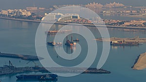 A breathtaking aerial view of the Palm Jumeirah during sunrise from a rooftop, Dubai, United Arab Emirates