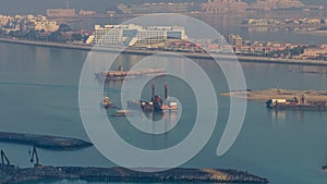 A breathtaking aerial view of the Palm Jumeirah during sunrise timelapse from a rooftop, Dubai, United Arab Emirates