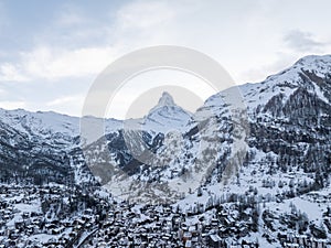 A breathtaking aerial view of Zermatt and the Matterhorn Peak, Swiss Alps, in winter.