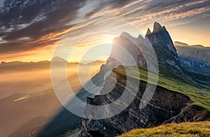 Breathtaking Alpine Highlands in Sunny Day. Impressively Beautiful Odle mountain range, Seceda peak in beautiful evening light at photo