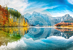 Breathtaking autumn scene of sunny morning on Almsee lake. Poppular travell destination