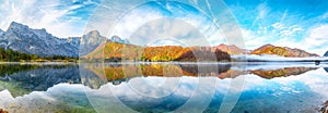 Breathtaking autumn scene of sunny morning on Almsee lake. Poppular travell destination