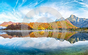 Breathtaking autumn scene of sunny morning on Almsee lake. Poppular travell destination