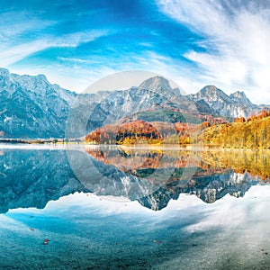 Breathtaking autumn scene of sunny morning on Almsee lake. Poppular travell destination