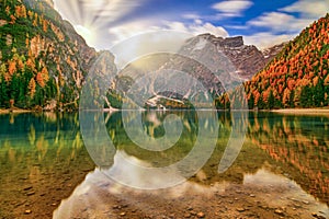 Breathtaking autumn scenery of Braies Lake, Dolomite Alps, Italy photo
