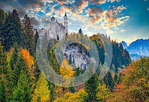 Breathtaking autumn scenery of Neuschwanstein Fairytale Castle at sunrise, Bavaria, Germany