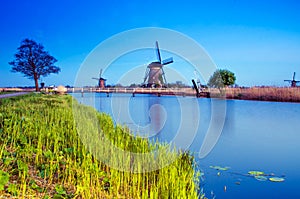 Breathtaking beautiful inspirational landscape with windmills in Kinderdijk, Netherlands. Fascinating places, tourist attraction