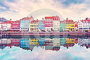 Breathtaking beautiful scenery with boats in the famous Nyhavn in Copenhagen, Denmark at sunrise. Exotic amazing places. Popular