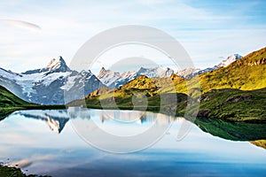Breathtaking beautiful scenery on the lake in the Swiss Alps. Wetterhorn, Schreckhorn, Finsteraarhorn et Bachsee. Exciting places