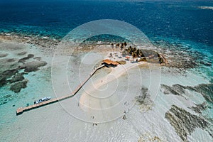 Breathtaking bird's eye view of a small island in Belize surrounded by Caribbean Sea