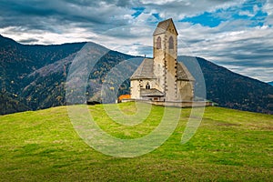 St Jakob church on the top of mountain, Dolomites, Italy photo