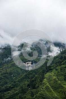 Breathtaking Green Landscape with Foggy Mountains and Waterfalls during Monsoon in Nepal