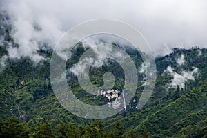 Breathtaking Green Landscape with Foggy Mountains and Waterfalls during Monsoon in Nepal