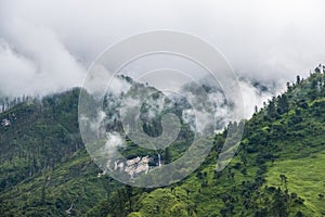 Breathtaking Green Landscape with Foggy Mountains and Waterfalls during Monsoon in Nepal