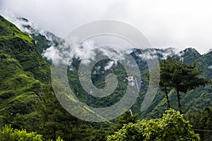 Breathtaking Green Landscape with Foggy Mountains and Waterfalls during Monsoon in Nepal