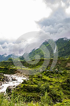 Breathtaking Green Landscape with Foggy Mountains and Waterfalls during Monsoon in Nepal