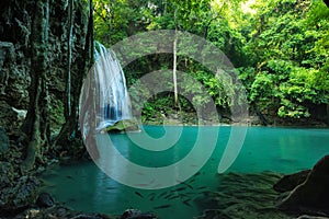 Breathtaking Green waterfall in deep forest, Erawan waterfall